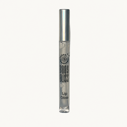 Clear Body Bliss lip gloss with silver cap on a warm ivory background