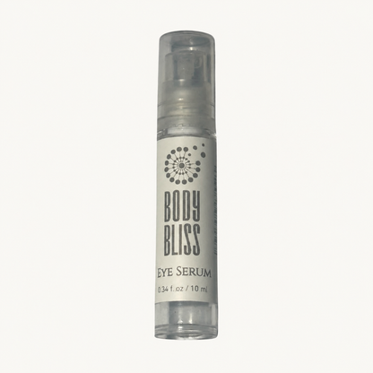 Body Bliss Eye Serum 10 ml pump bottle on a warm ivory background
