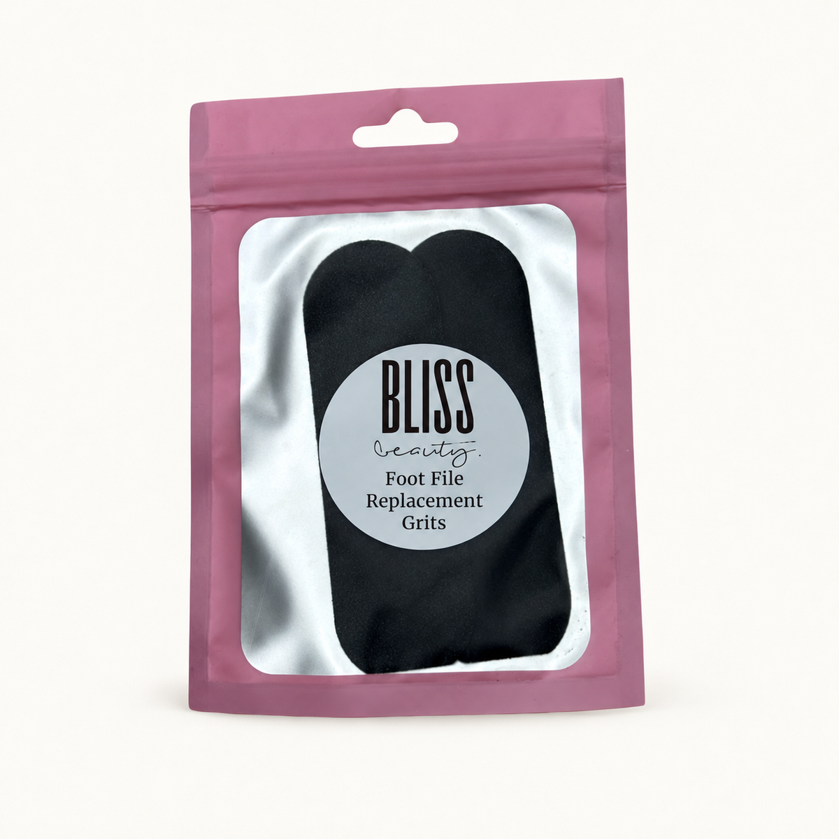 Body Bliss foot file replacement grits in the original pink pouch on a warm ivory background