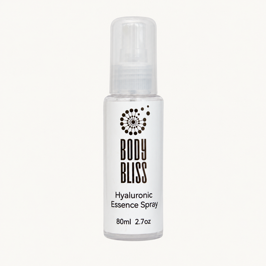 Body Bliss Hyaluronic Essence Spray 80ml bottle on a warm ivory background