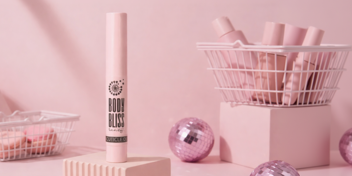 Cuticle Oil Pen on a pink background surrounded by various decorative 